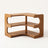 Three-tier bamboo corner desk shelf on a plain off-white background