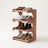 4-tier corner shoe rack in use with sneakers, boots, and flats on each shelf, white studio background