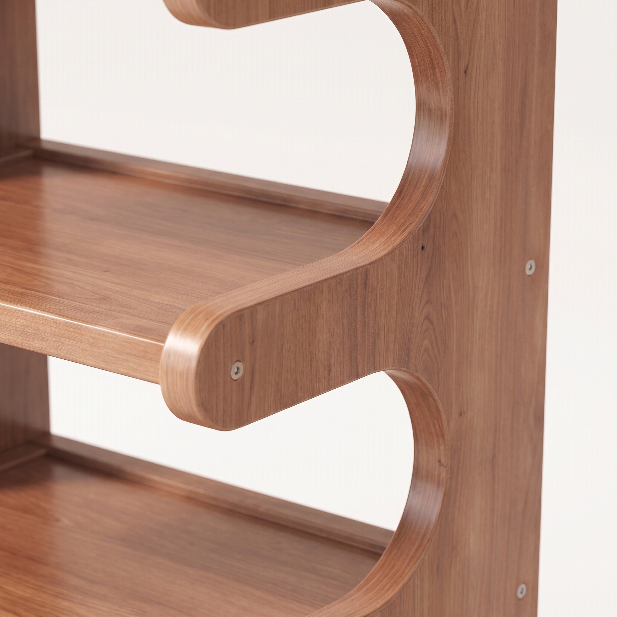Close-up detail of the curved wood-grain shelf edge and joinery on the corner shoe rack