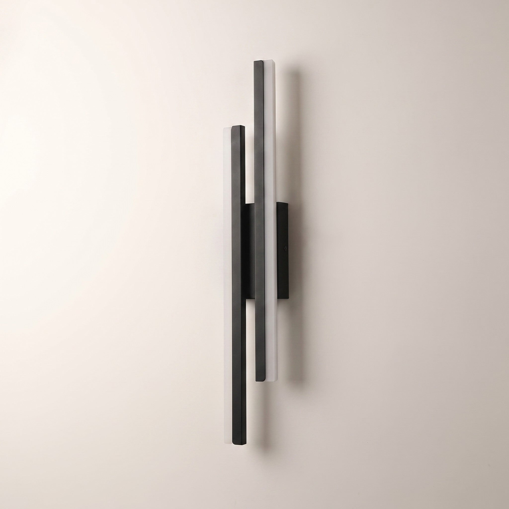 Slim acrylic wall sconce, left-facing, studio packshot