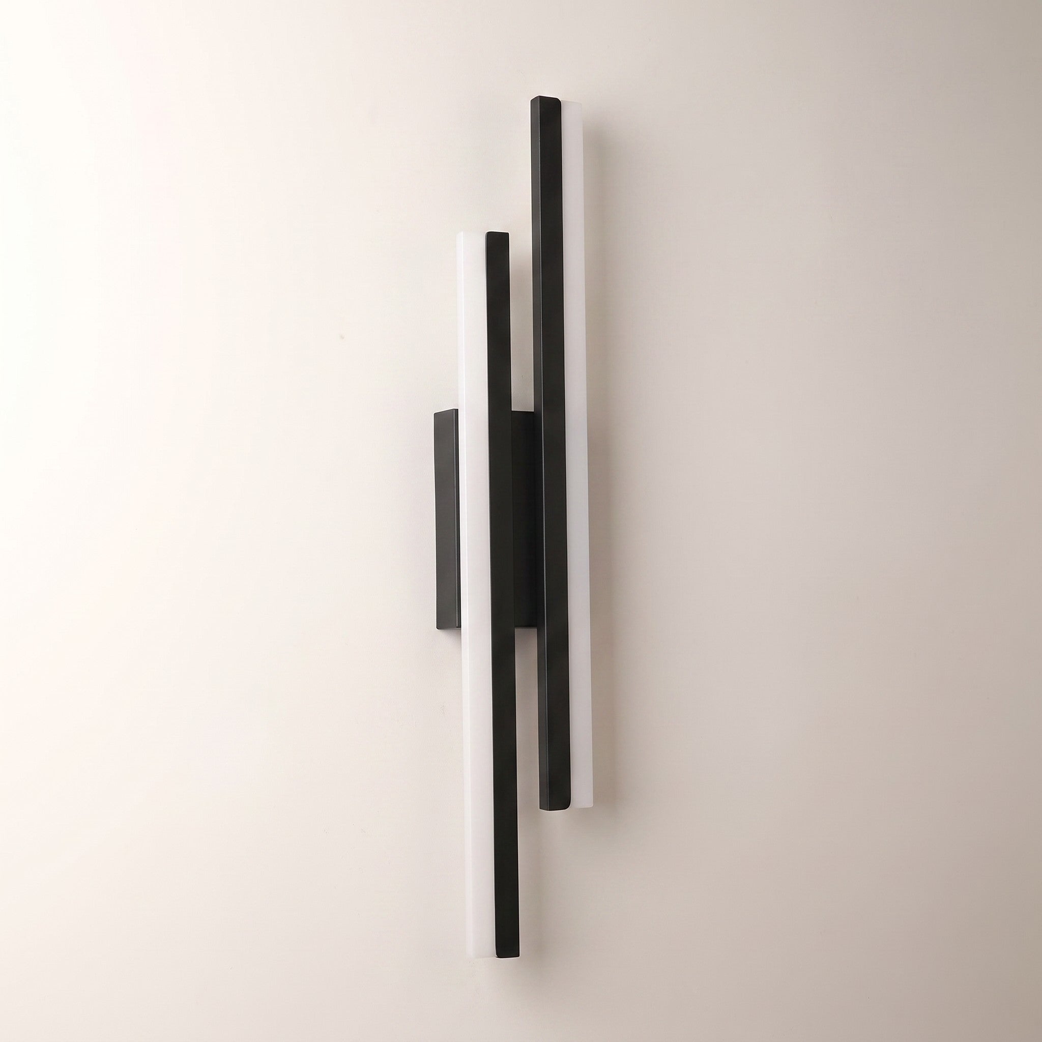 Slim acrylic wall sconce, right-facing, studio packshot