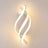 Spiral LED wall sconce in white, lit, glowing ribbon on a white frame