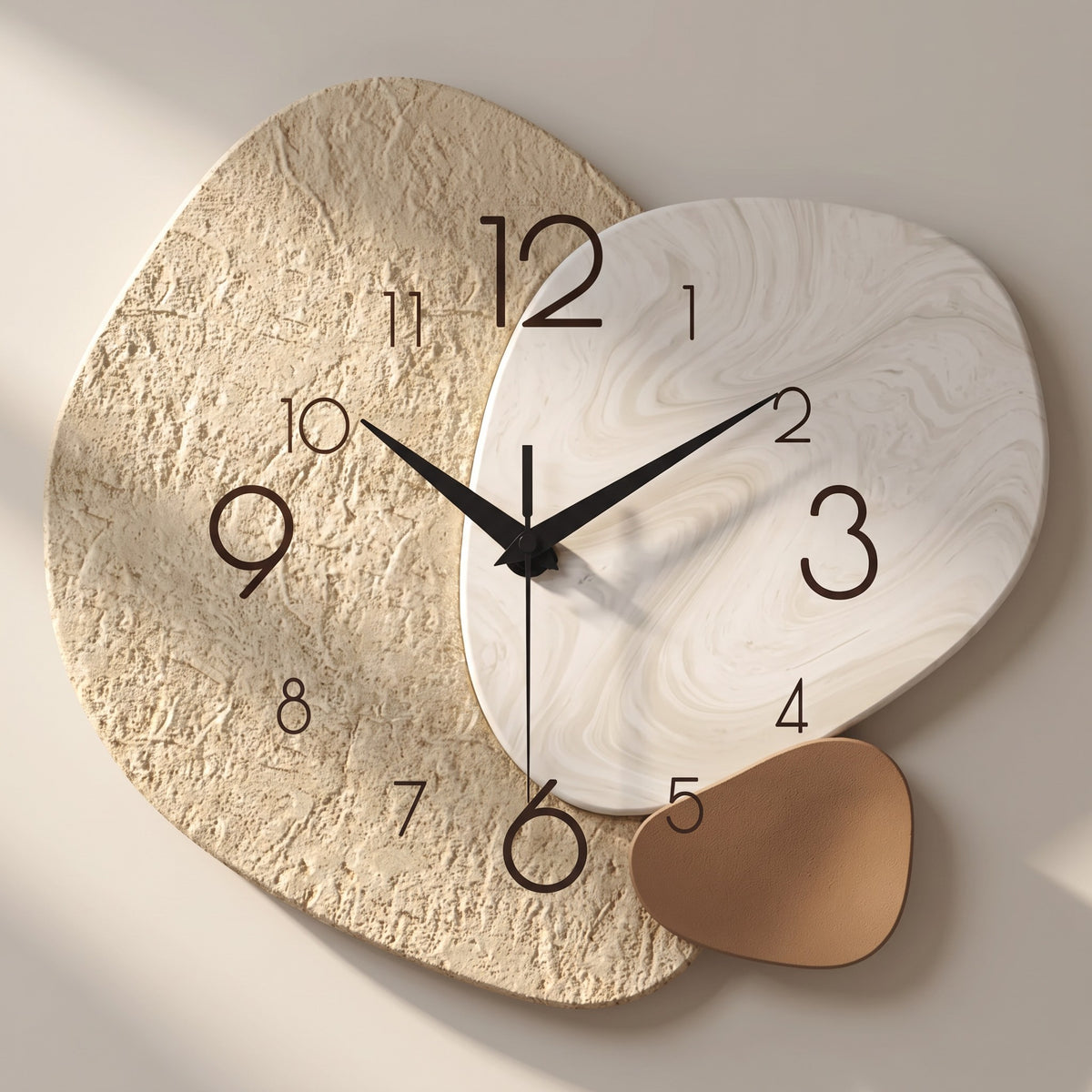Close-up of the Three Pebble Silent Wall Clock showing the printed seam where the sand-textured pattern meets the marbled pattern on the single-piece face.