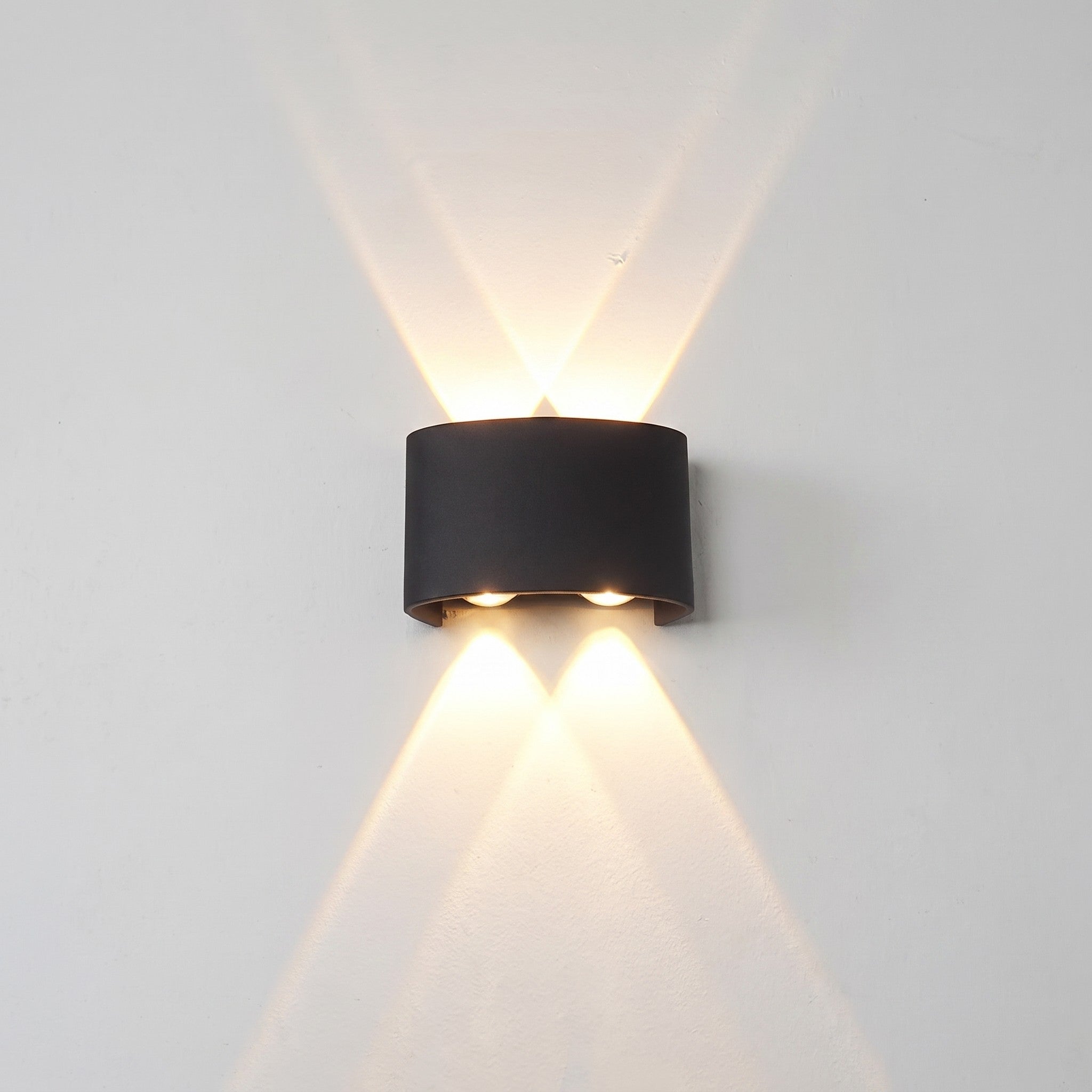 Up-down wall light, 4-light version, lit on a wall