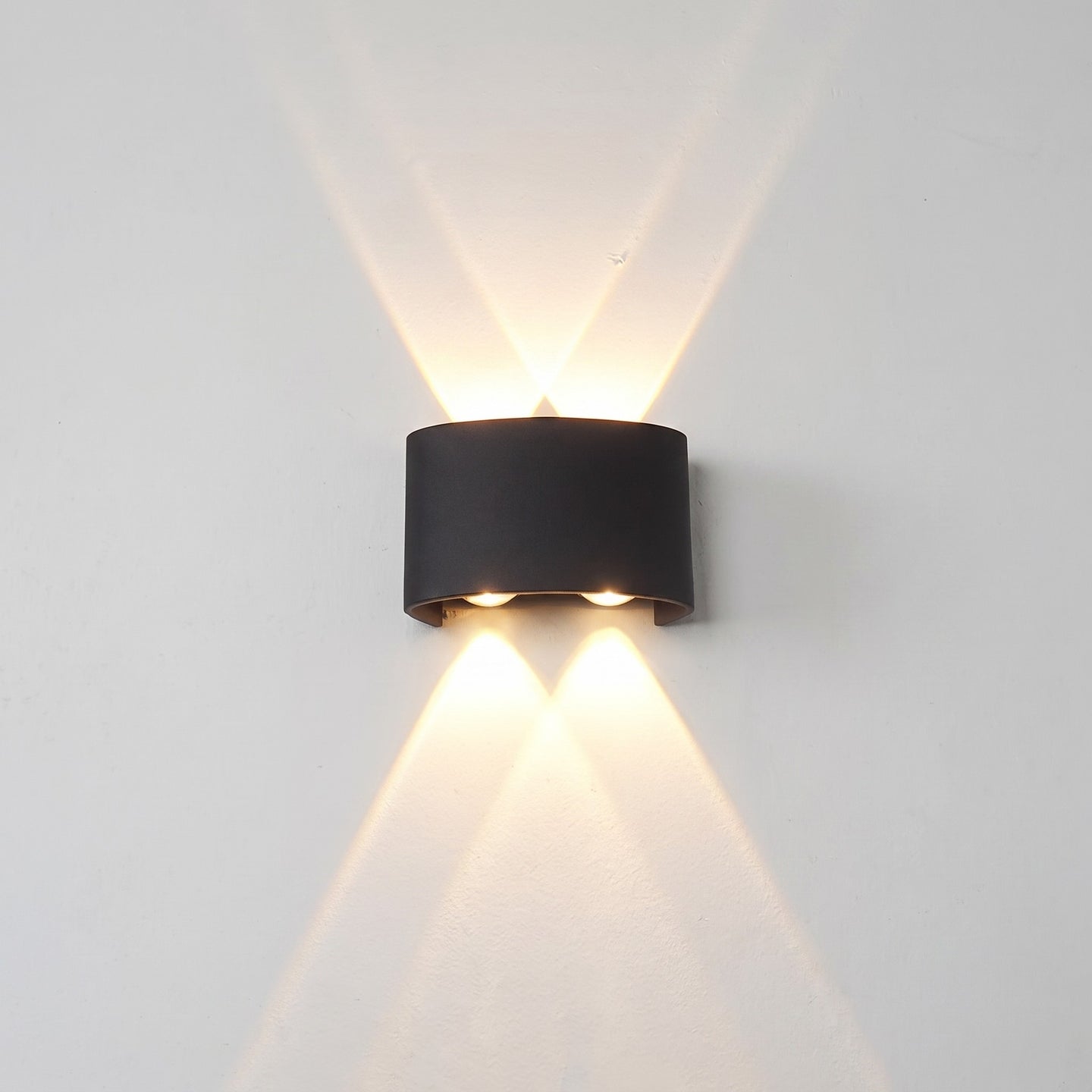 Up-down wall light, 4-light version, lit on a wall