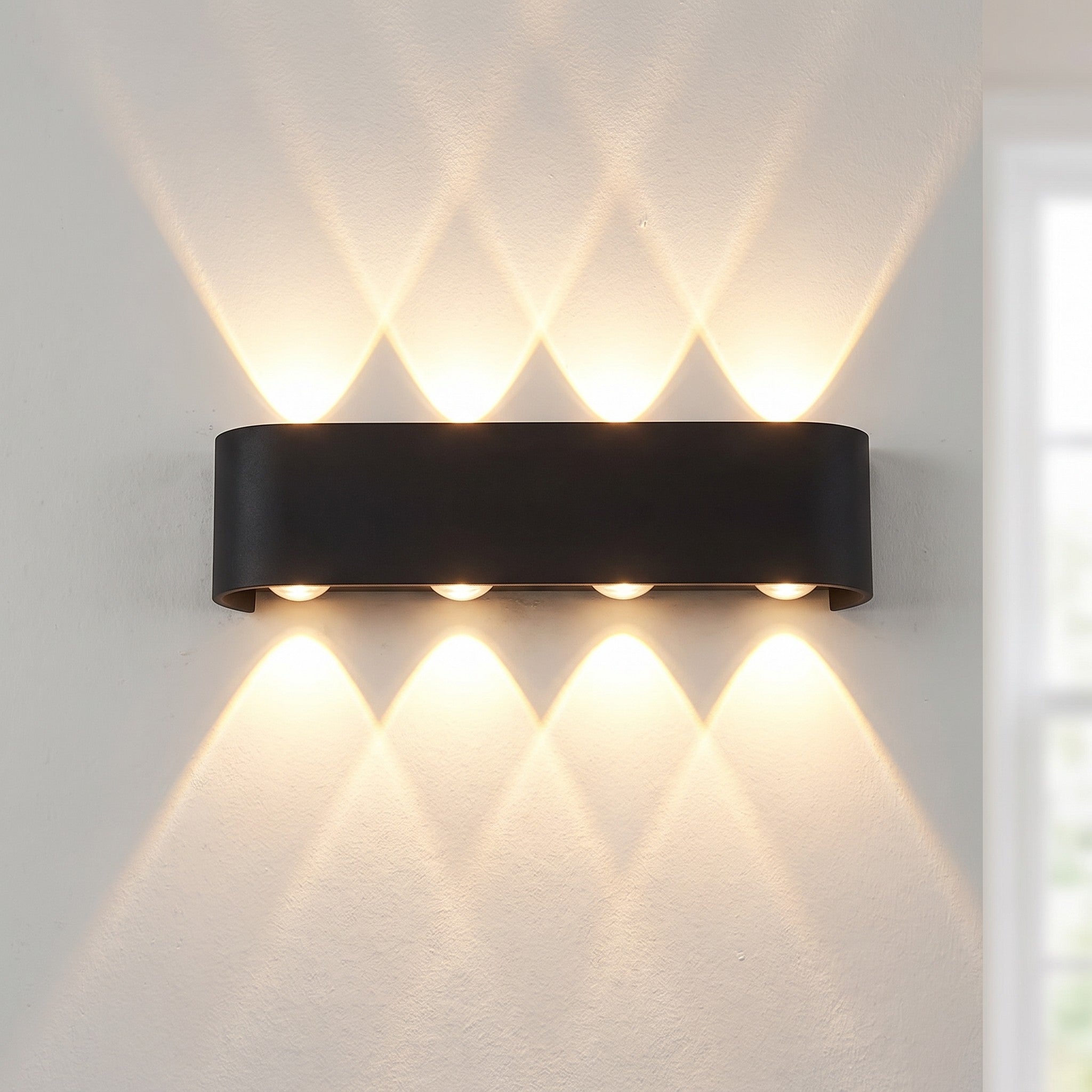 Up-down wall light, 8-light version, lit on a wall