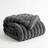 Folded gray blanket on a white background
