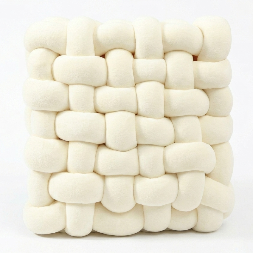 Chunky knit accent pillow in cream, white background