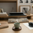 Wooden desk setup with keyboard, mouse, mug, and books in a home office.
